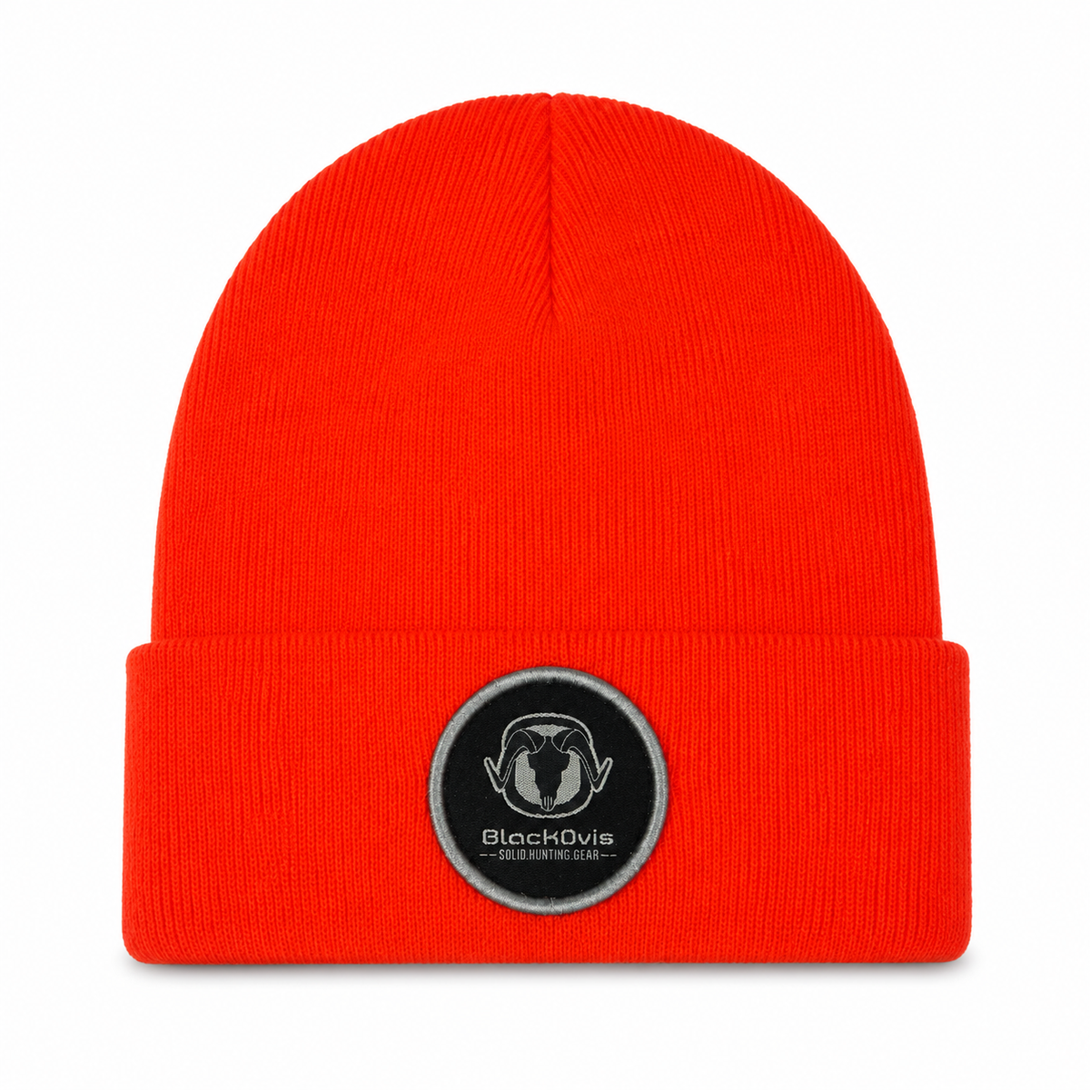 A bright red ribbed knit beanie hat with a folded cuff, featuring a circular black embroidered patch on the front with a ram's head logo and the text 'BlackOvis'.