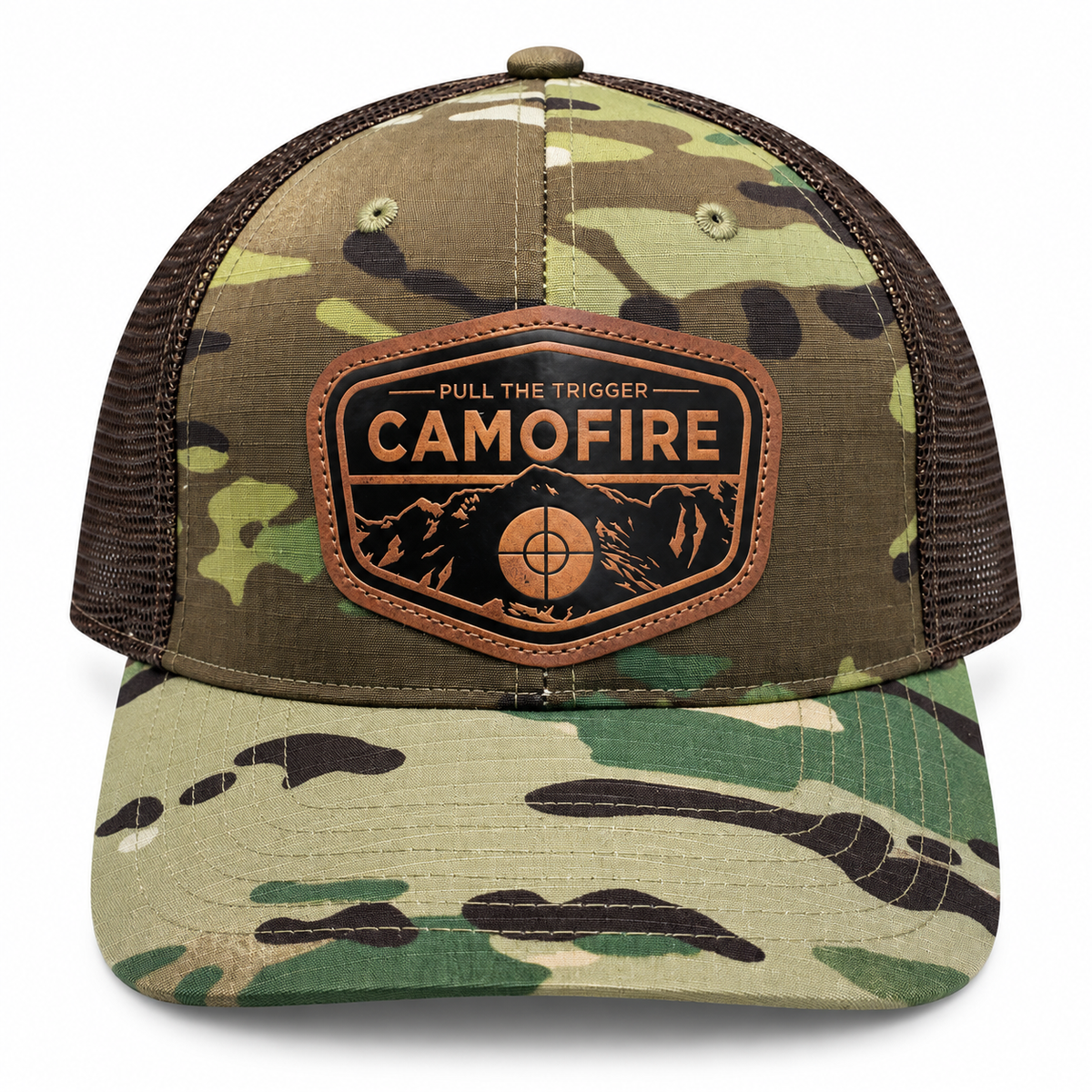 A camouflage trucker hat with brown mesh side panels and a brown leather patch on the front that reads 'PULL THE TRIGGER CAMOFIRE' with a mountain and target graphic.