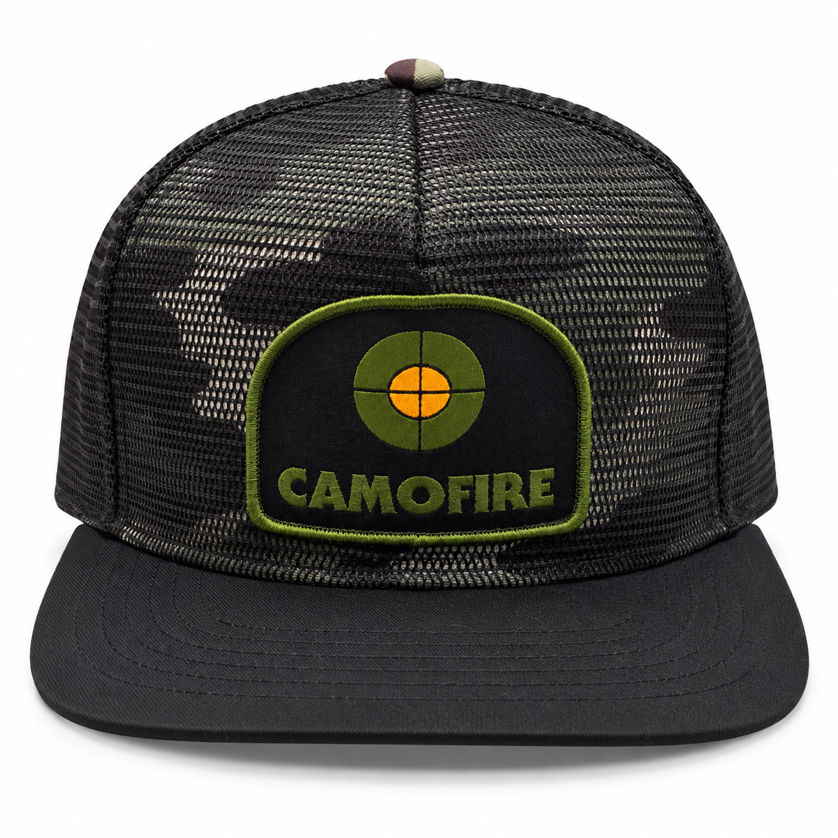 A black trucker cap with a dark camouflage mesh back and a black flat brim, featuring a green and orange embroidered patch on the front with the text 'CAMOFIRE'.