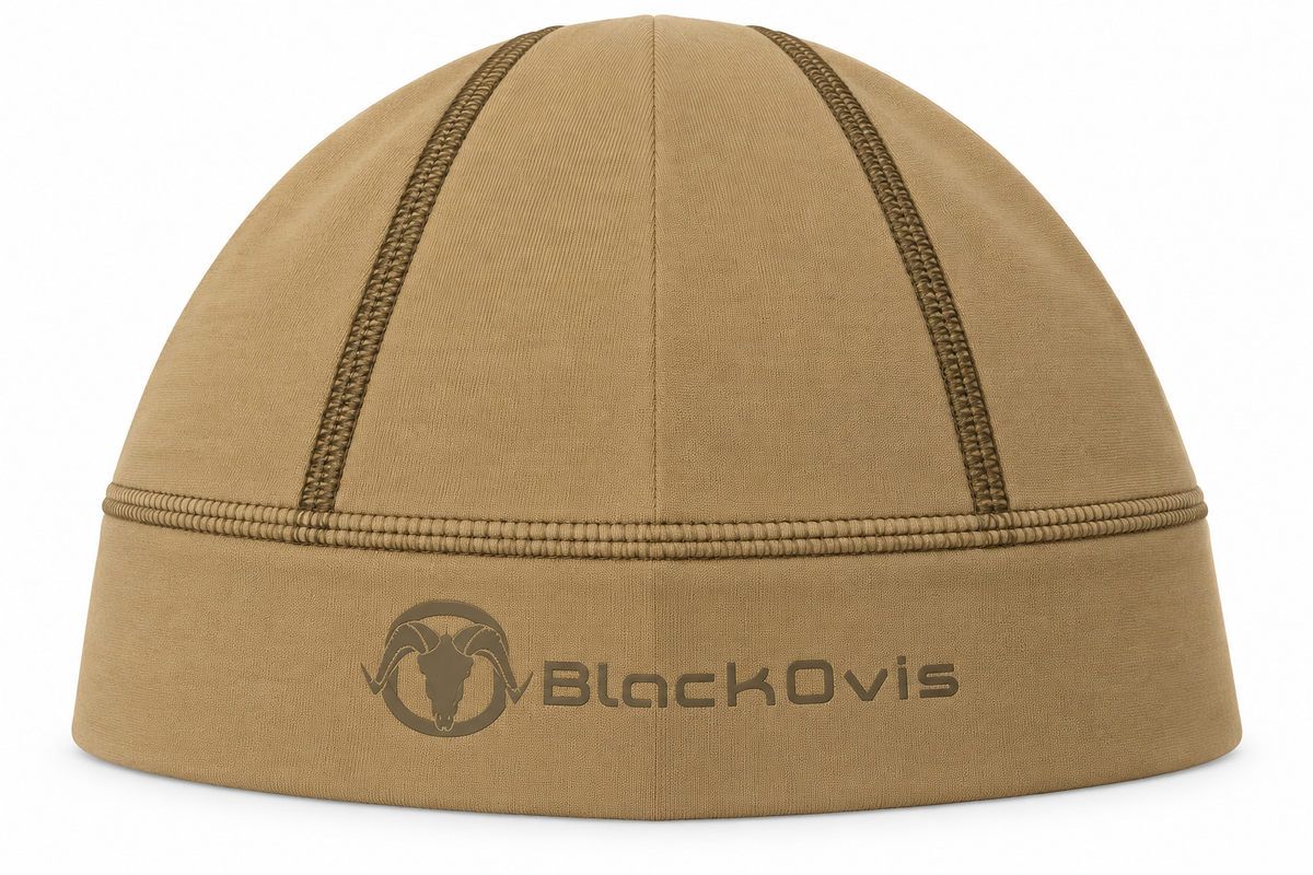 A tan fleece balaclava with dark brown contrast stitching and a dark brown embroidered BlackOvis logo on the front cuff, shown against a plain white background.