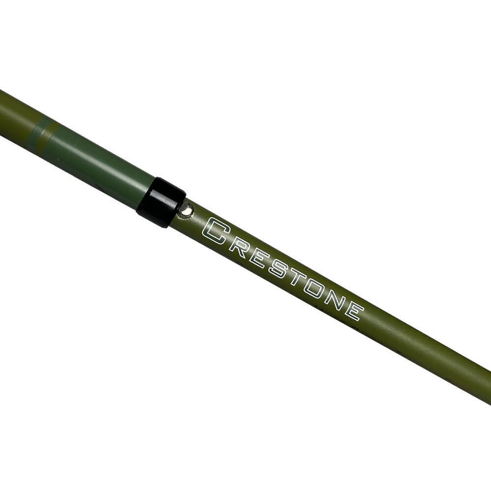 Close-up of an olive green CRESTONE hiking pole with a black joint cap and white brand lettering, shown on a plain white background.