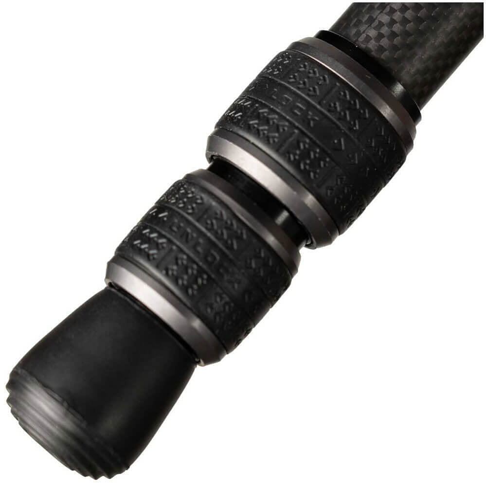 Close-up of a black carbon-fiber handled tool or accessory with textured grip rings and metallic silver bands, shown on a plain white background.