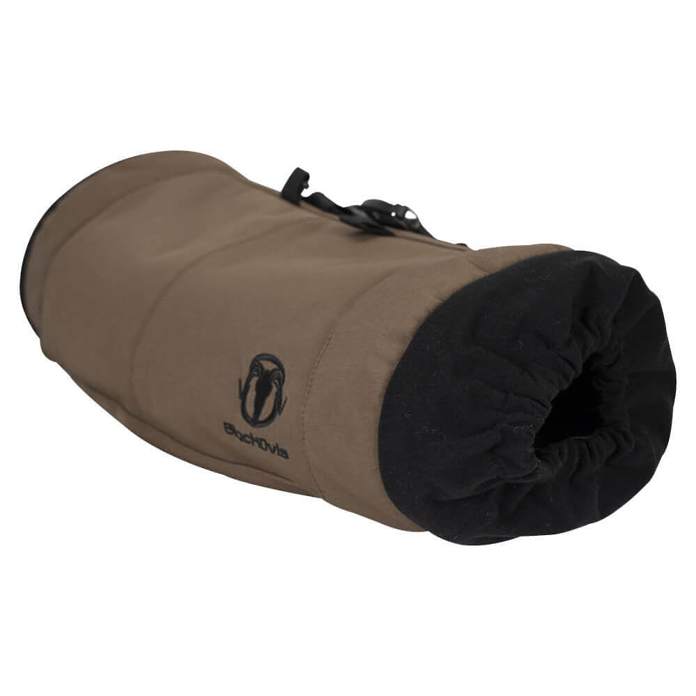 A rolled-up tan and black Exova insulated bag or sleeve on a plain white background, showing the Exova logo on the tan fabric.