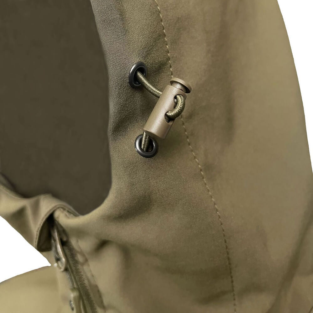 Close-up of an olive green jacket or hoodie showing a drawstring toggle with a metal cord and black eyelets, along with a zipper detail.